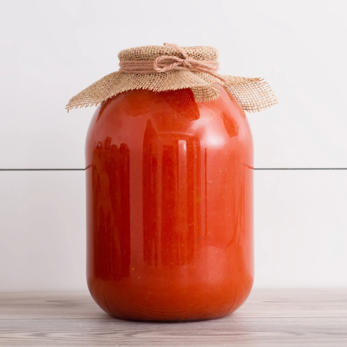 A jar of homemade tomato juice