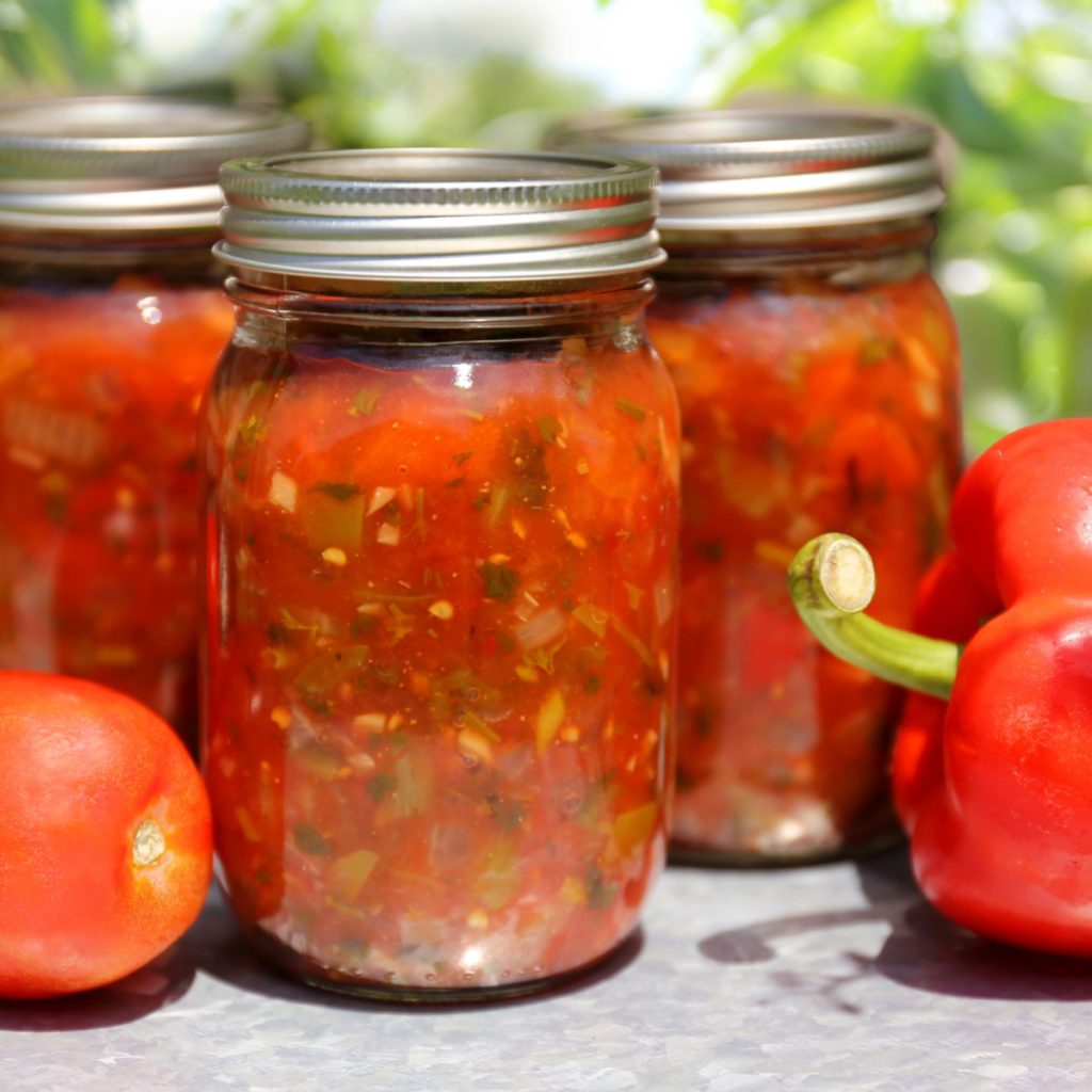 Jars of salsa and garden produce