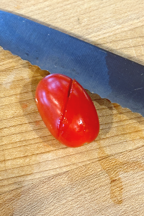 cutting a grape tomato